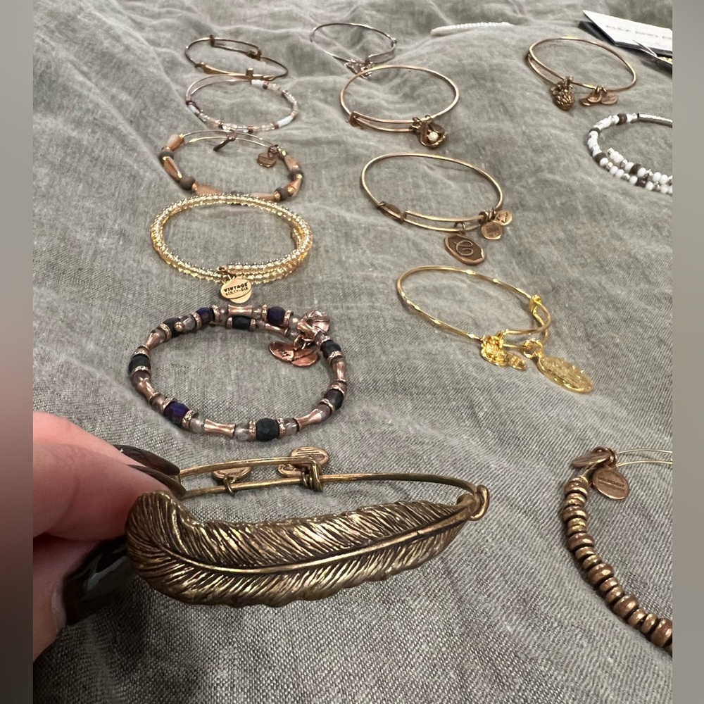 Variety of Alex and Ani bracelets with boxes and most cards included.